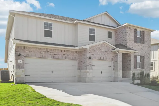 front view of a house with a yard