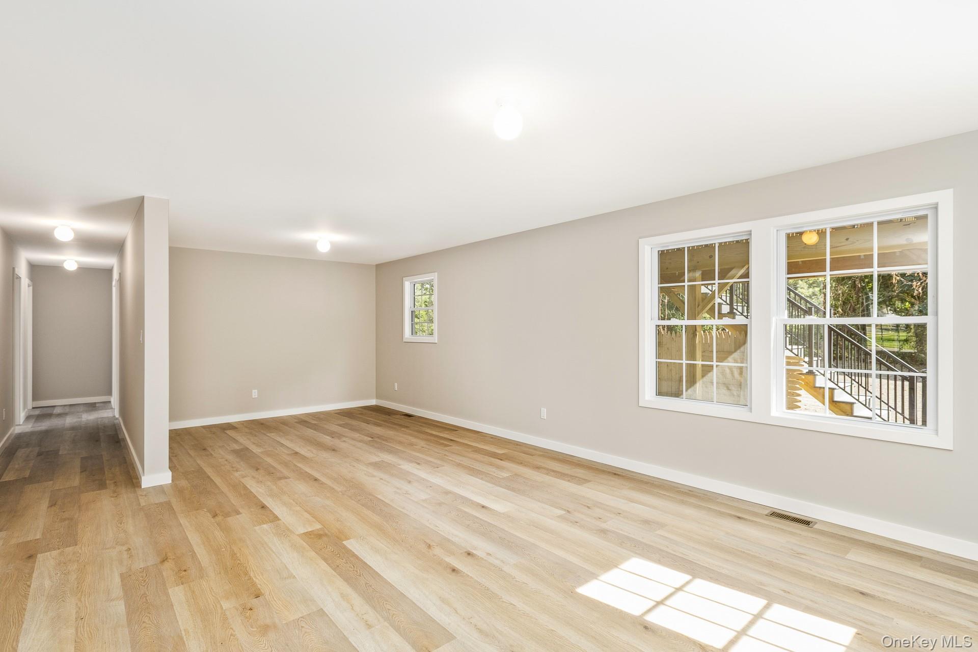 92 Park Street Blue Point, NY 11715 - Photo 11 of 32 a view of an empty room with a window