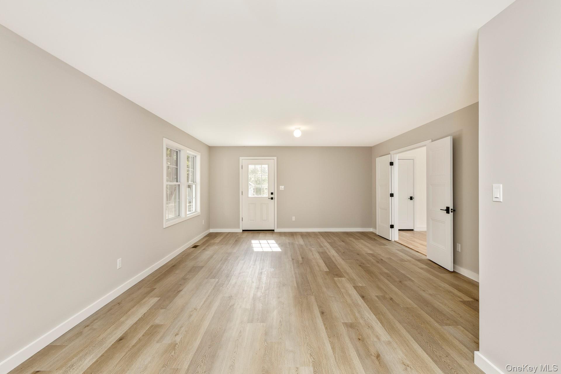 92 Park Street Blue Point, NY 11715 - Photo 12 of 32 a view of an empty room and window