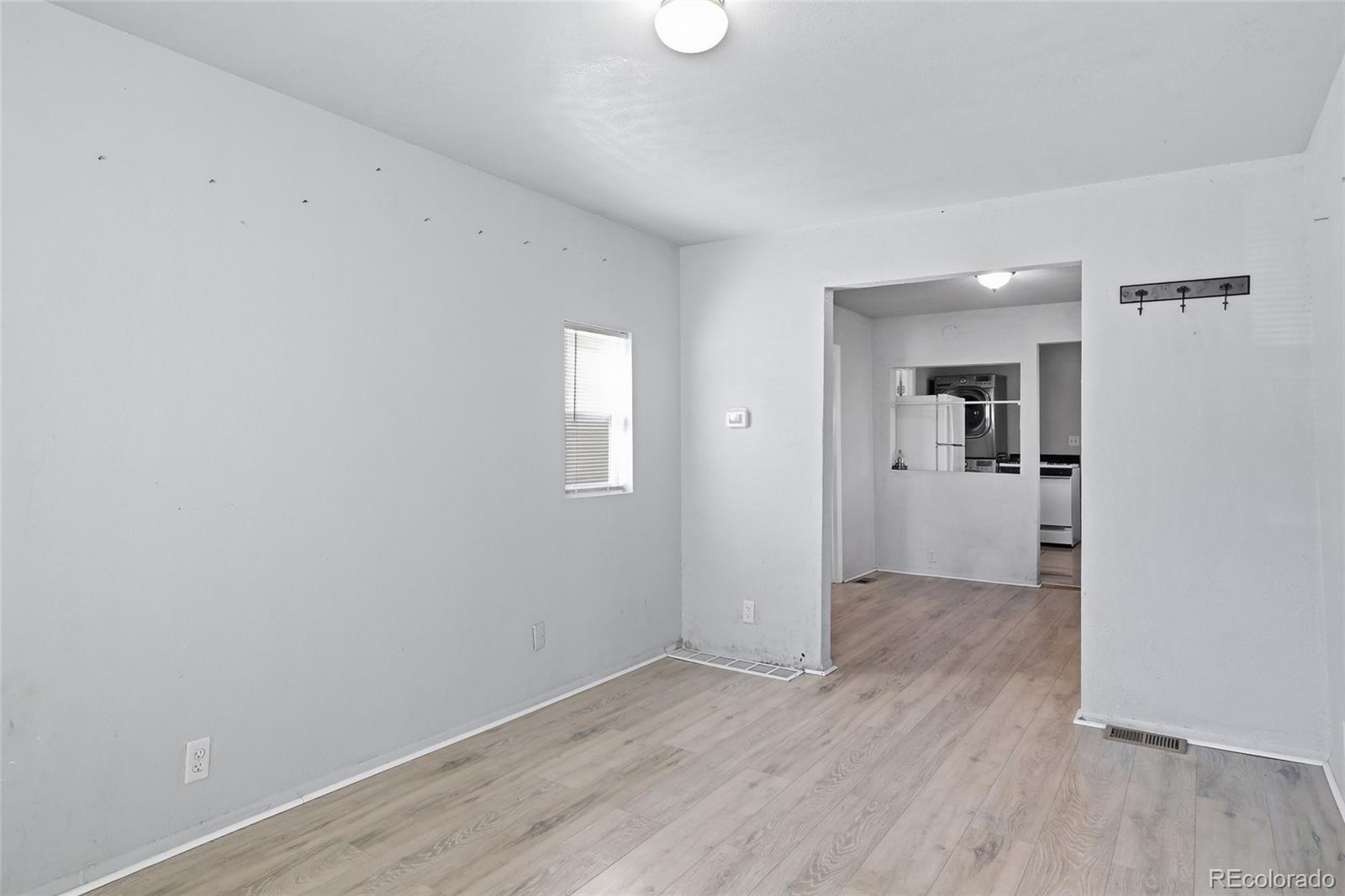 165 Hooker Street Denver, CO 80219 - Photo 4 of 11 wooden floor in an empty room