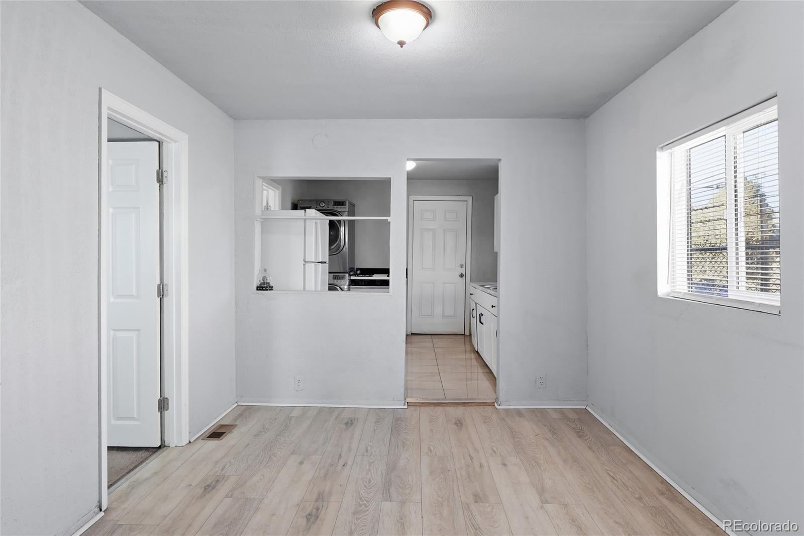 165 Hooker Street Denver, CO 80219 - Photo 5 of 11 wooden floor in an empty room