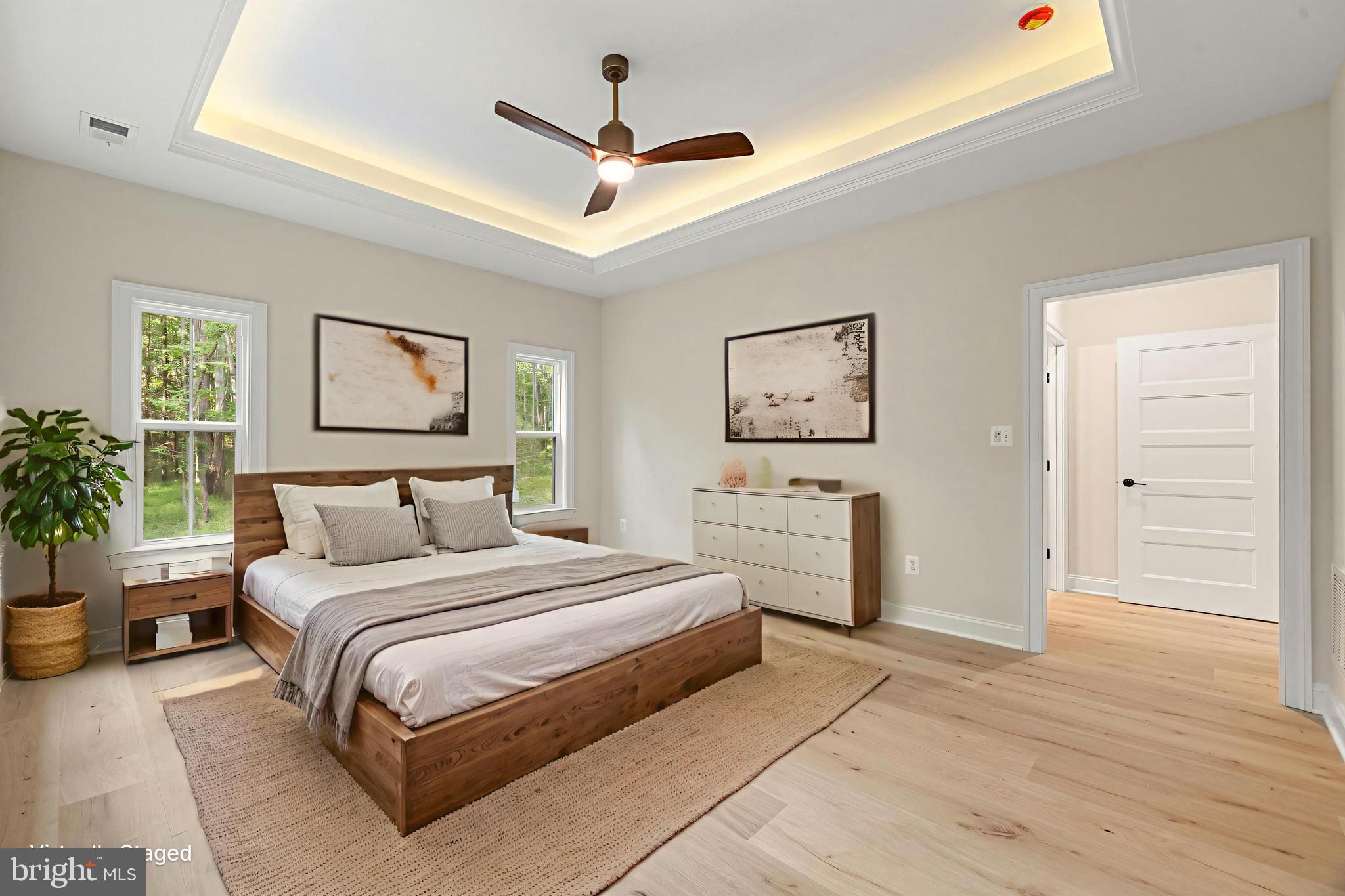 7329 Riley Road Warrenton, VA 20187 - Photo 11 of 69 a bedroom with a large bed and a chandelier