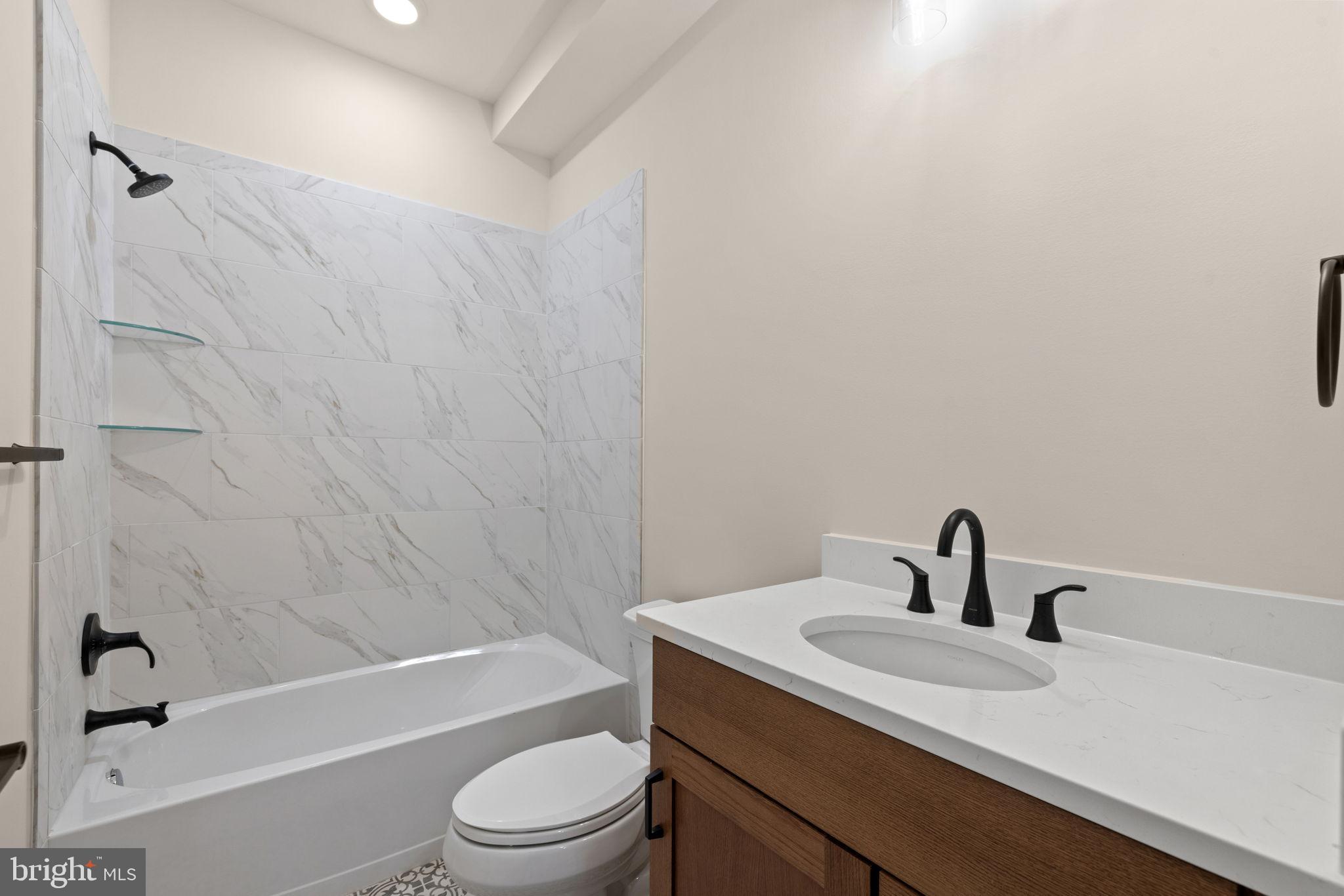 7329 Riley Road Warrenton, VA 20187 - Photo 28 of 69 a bathroom with a sink a toilet and a bathtub