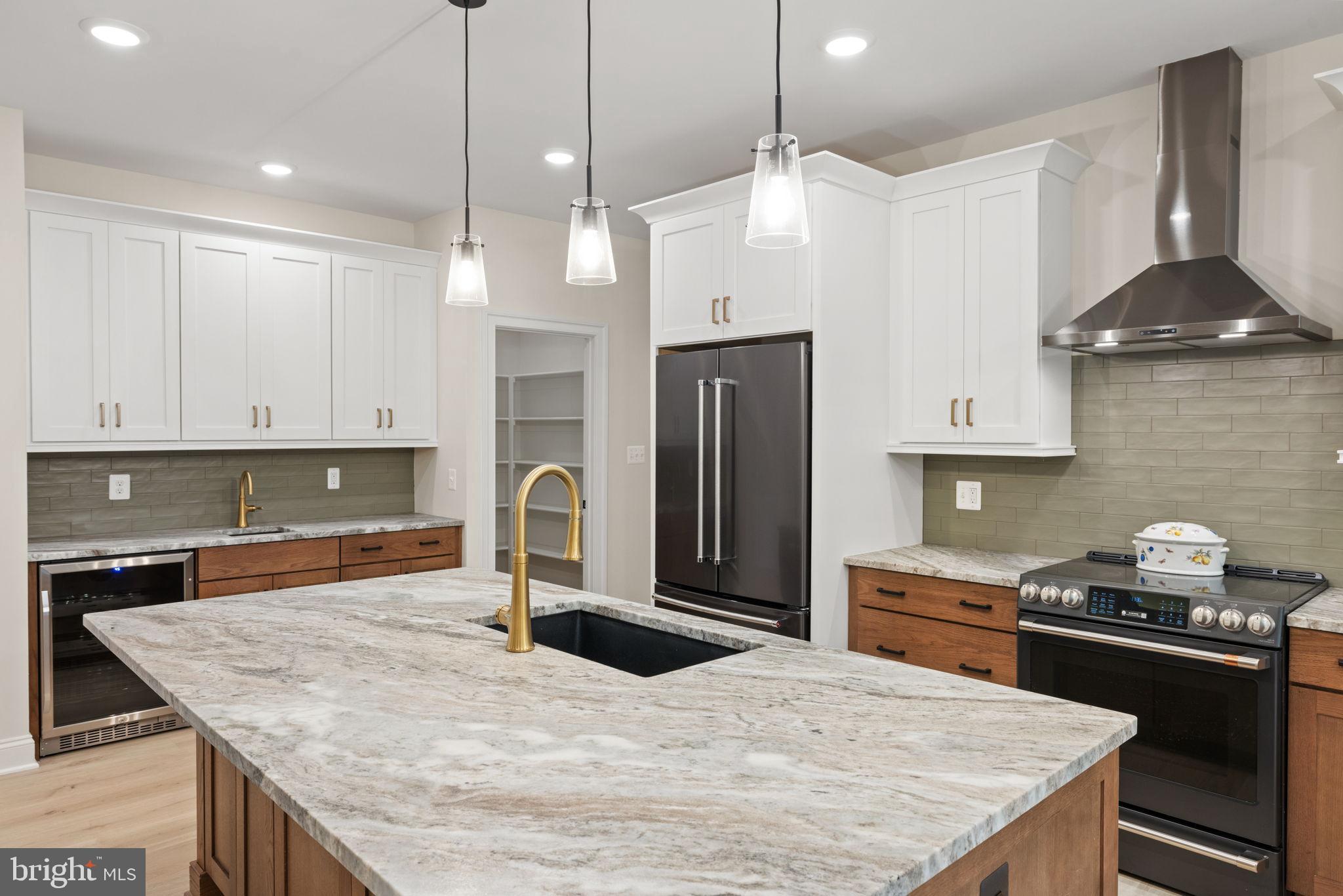 7329 Riley Road Warrenton, VA 20187 - Photo 32 of 69 a kitchen with stainless steel appliances granite countertop a sink a stove and a refrigerator