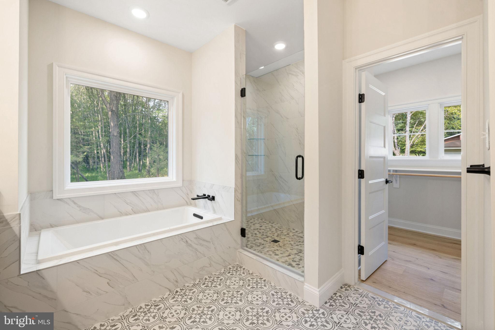 7329 Riley Road Warrenton, VA 20187 - Photo 58 of 69 a bathroom with a bathtub and a shower