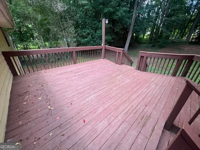 a view of backyard with hardwood and deck