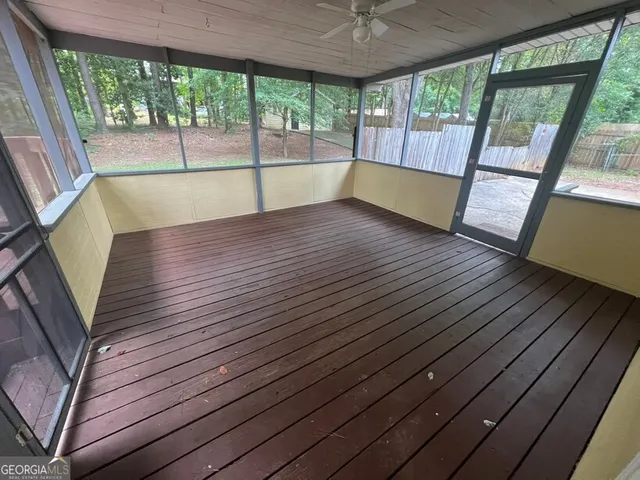 a view of a tree in the middle of a yard