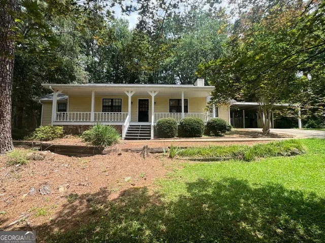 a house view with a garden space