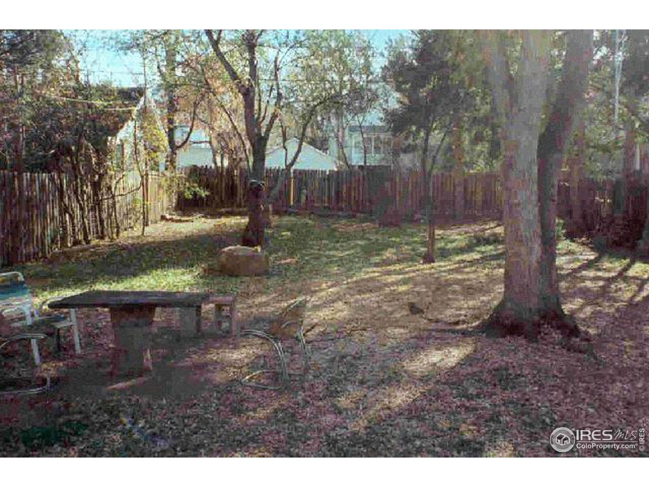 826 Maxwell Avenue Boulder, CO 80304 - Photo 6 of 6 a backyard of a house with lots of green space