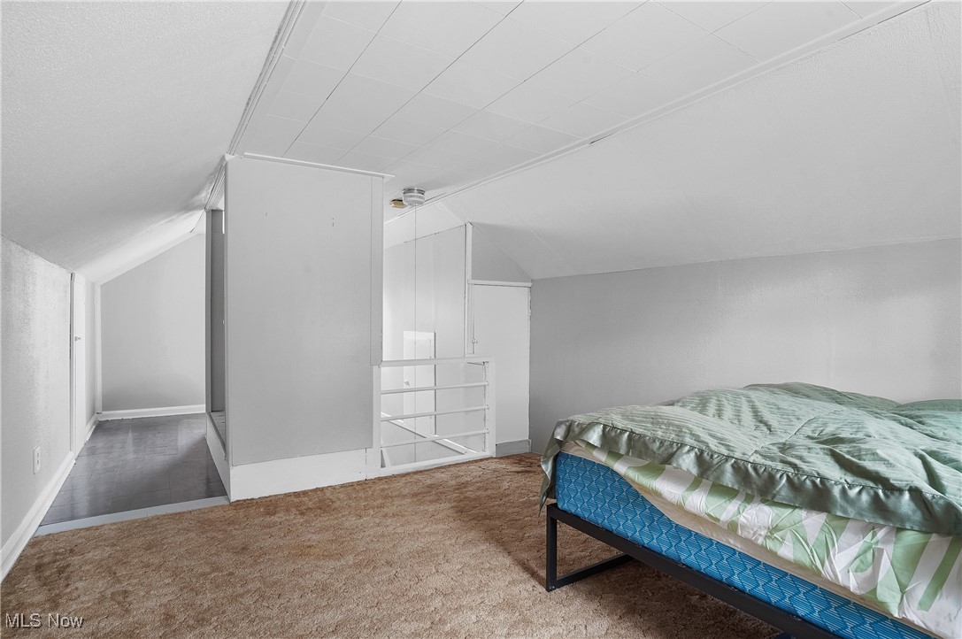 3206 9th Street Northwest Canton, OH 44708 - Photo 24 of 32 Bedroom featuring carpet and vaulted ceiling
