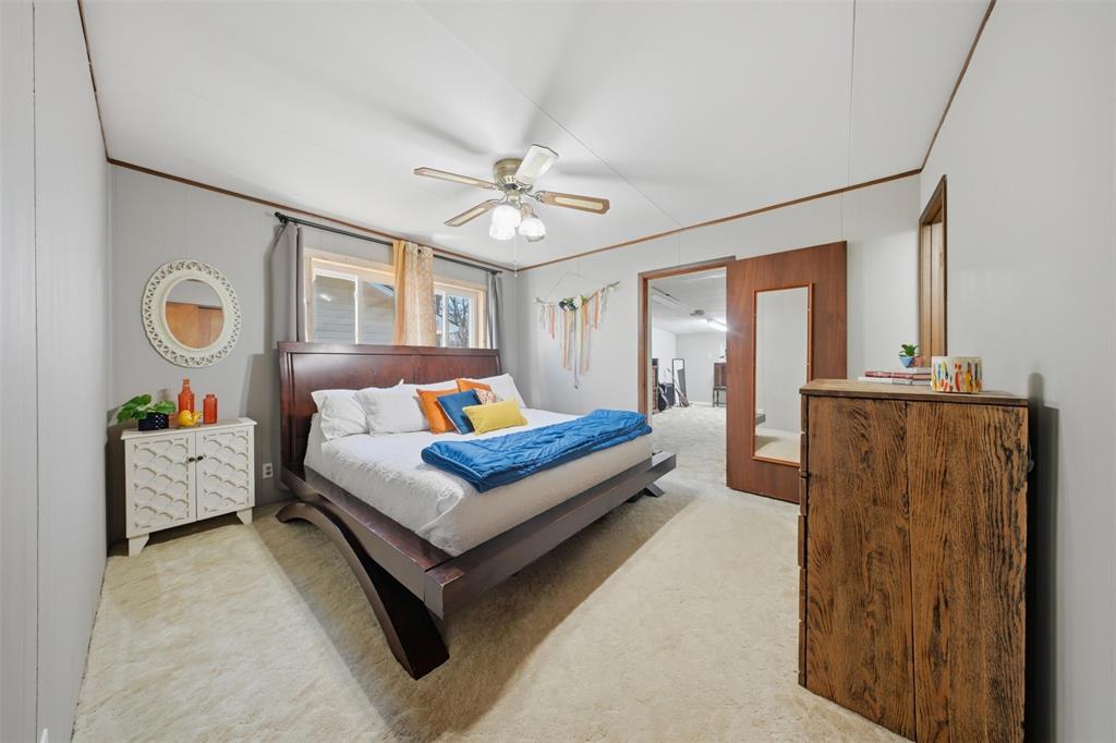 610 Walter Road Gainesville, TX 76240 - Photo 11 of 33 a bedroom with furniture and a large window