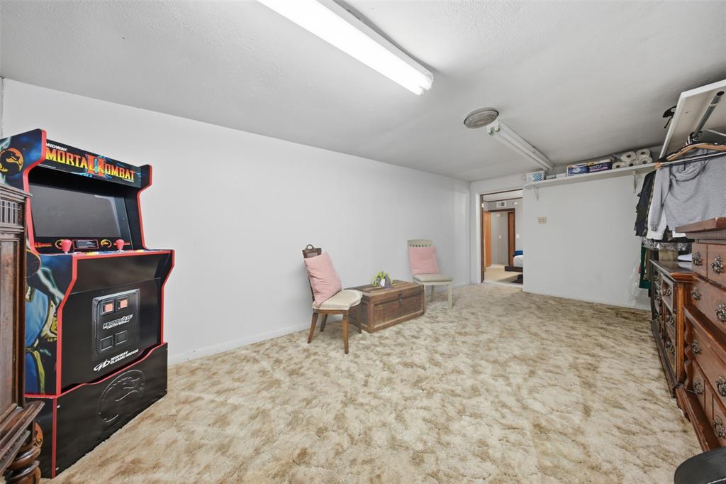 610 Walter Road Gainesville, TX 76240 - Photo 16 of 33 a bedroom with a bed and wooden floor