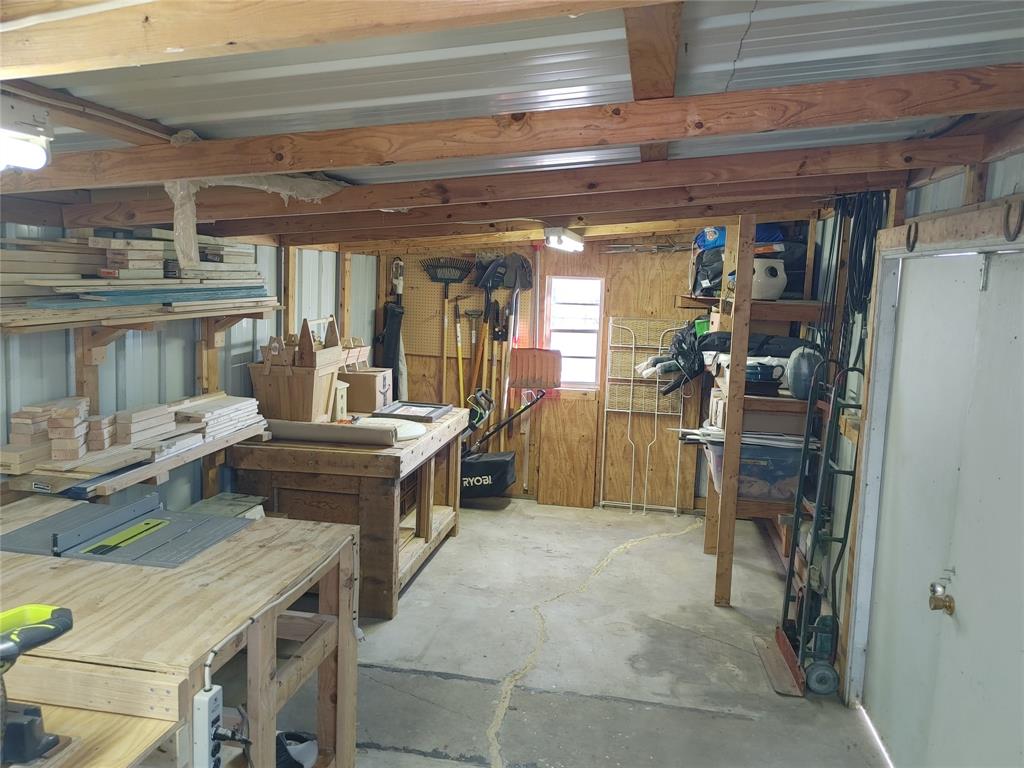 610 Walter Road Gainesville, TX 76240 - Photo 31 of 33 a kitchen with a sink and refrigerator