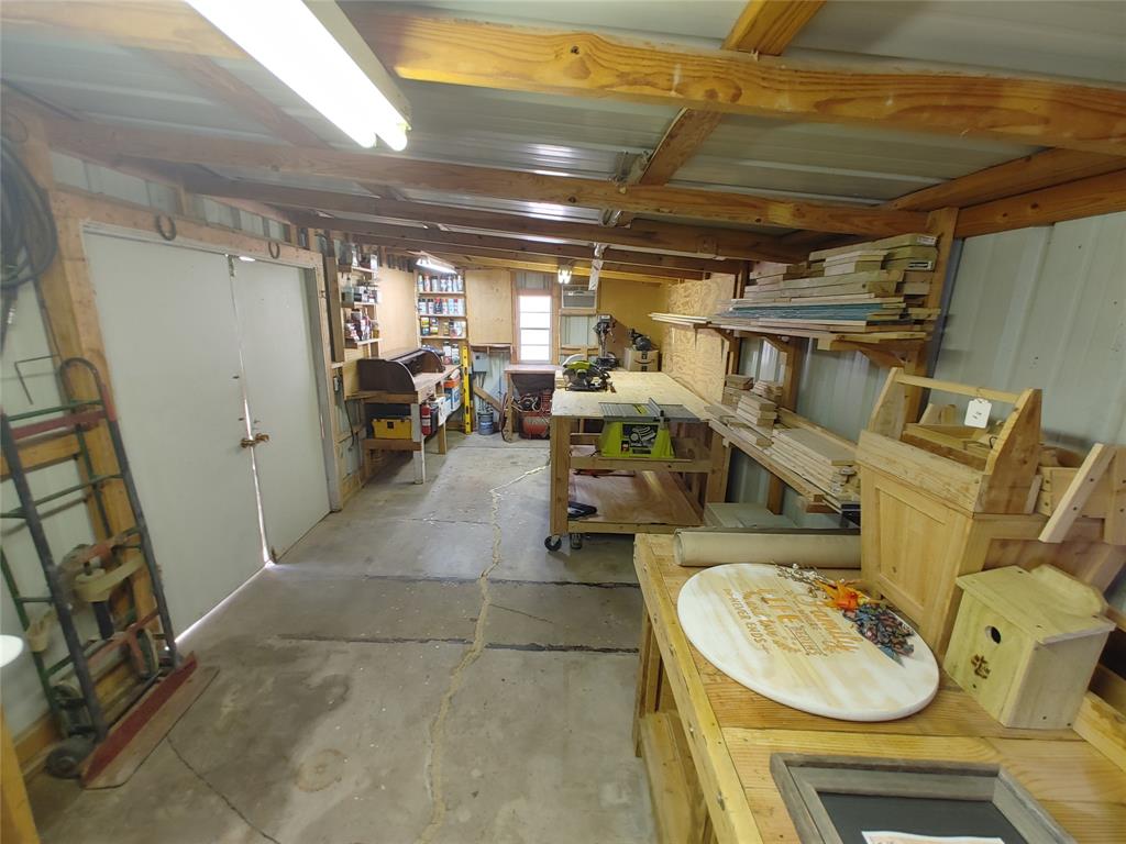 610 Walter Road Gainesville, TX 76240 - Photo 32 of 33 a utility room with lot of furniture and a window