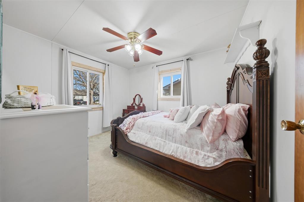 610 Walter Road Gainesville, TX 76240 - Photo 9 of 33 a bed sitting in a bedroom next to a window