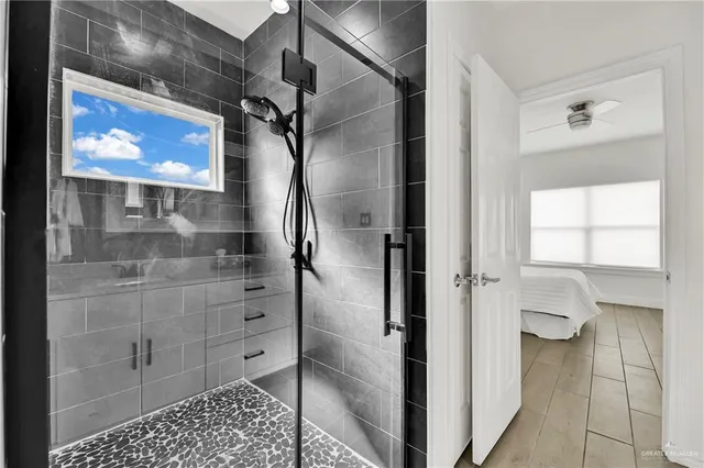 a bathroom with a double vanity sink and mirror