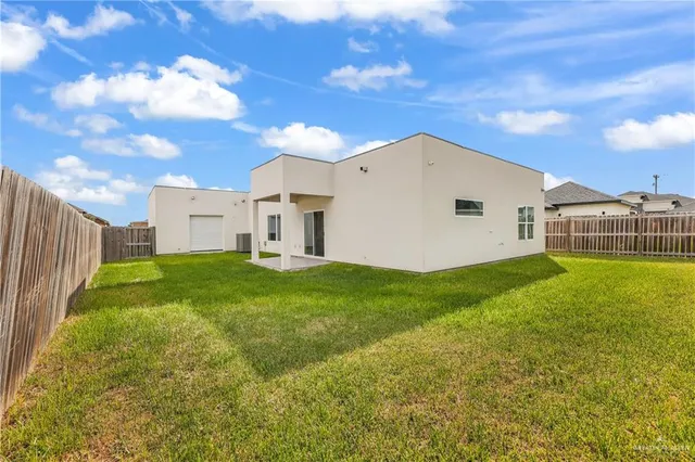 an aerial view of a house with a ocean view