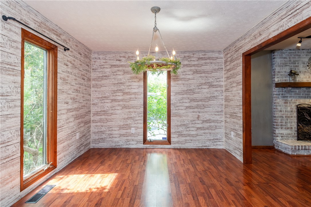 6750 Little Twin Road Germantown, OH 45327 - Photo 8 of 88 This inviting dining room offers warmth with wood flooring and a charming fireplace.