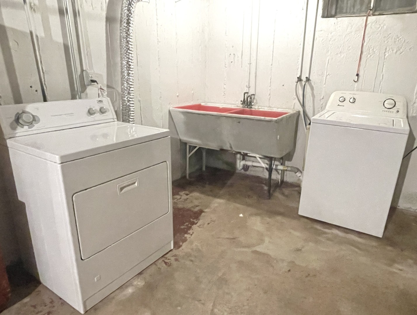 1415 Plain Street Peru, IL 61354 - Photo 12 of 17 a room with a washing machine and sink
