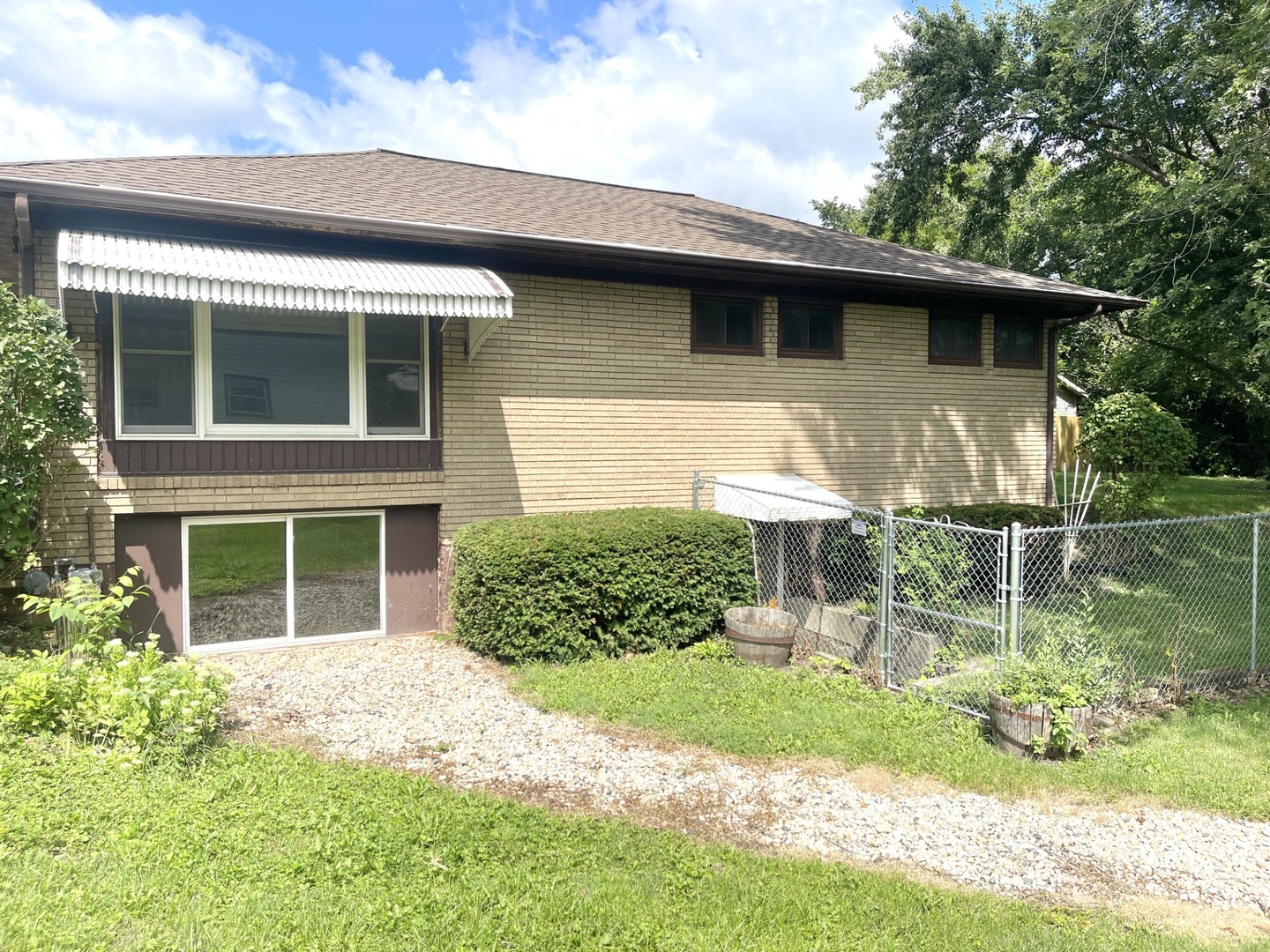 1415 Plain Street Peru, IL 61354 - Photo 14 of 17 a front view of a house with garden