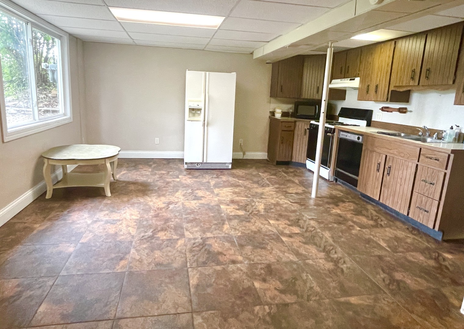 1415 Plain Street Peru, IL 61354 - Photo 10 of 17 a kitchen with stainless steel appliances a stove refrigerator sink and cabinets