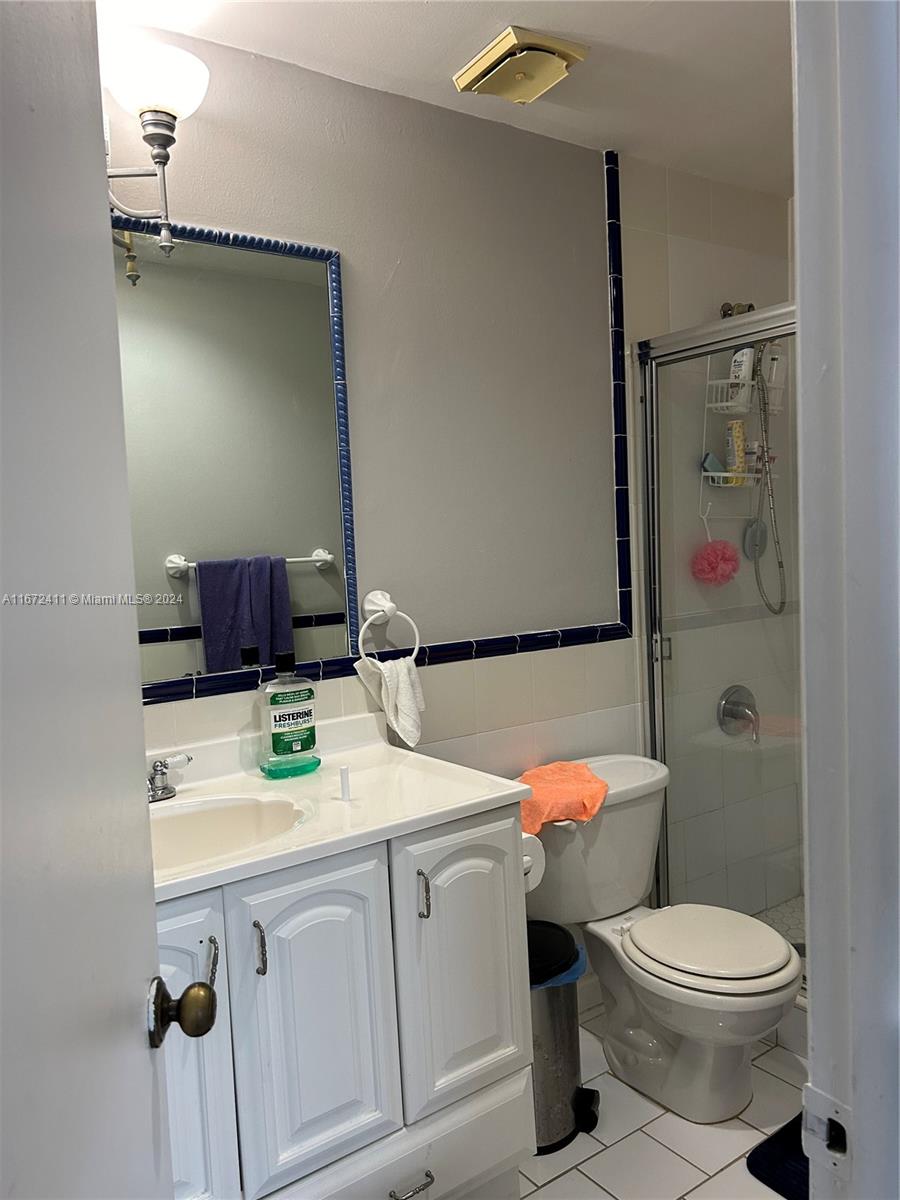 West End Miami, FL 33193 - Photo 19 of 19 a bathroom with a sink vanity mirror and toilet