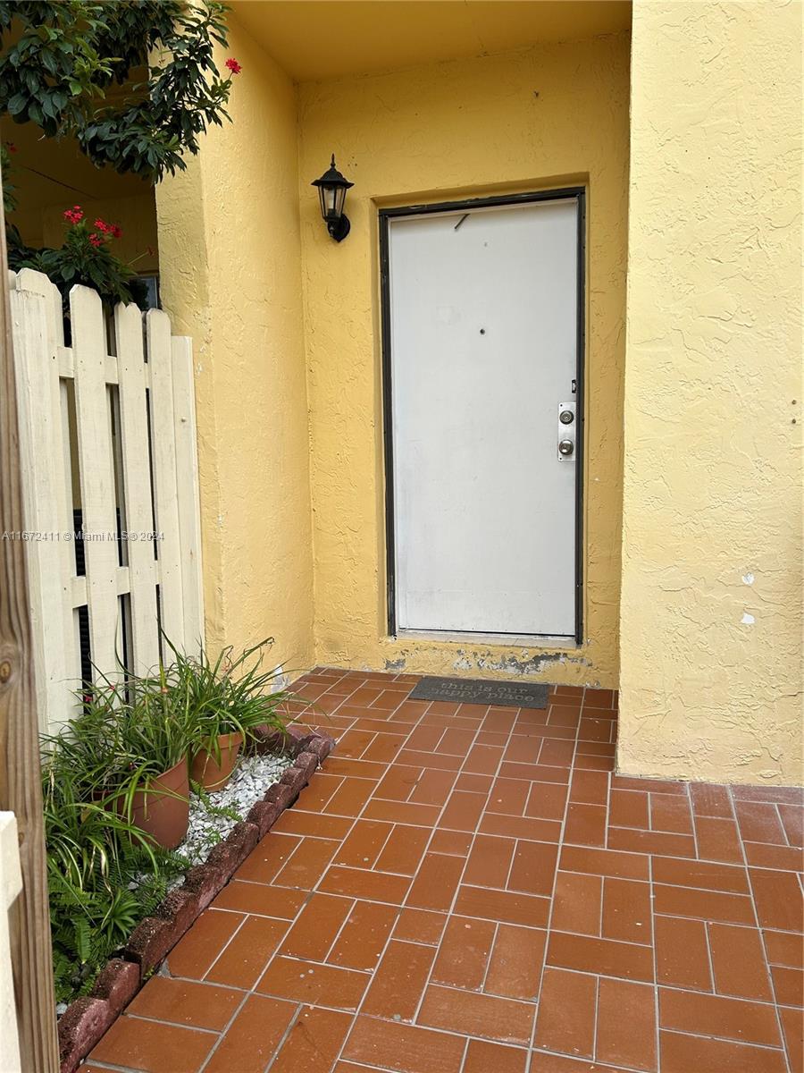 West End Miami, FL 33193 - Photo 2 of 19 a view of a door with wooden fence