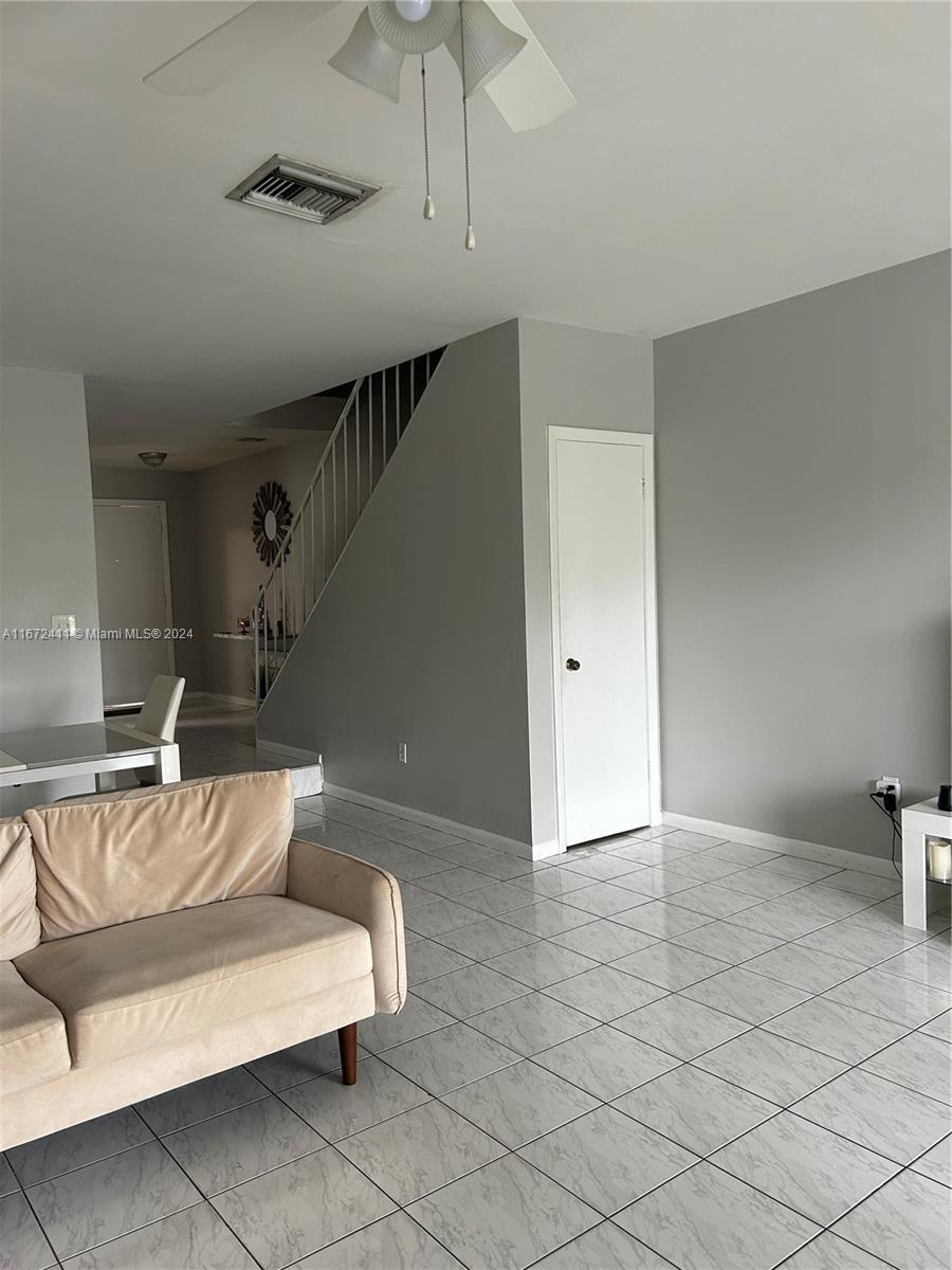 West End Miami, FL 33193 - Photo 6 of 19 a living room with furniture and a potted plant