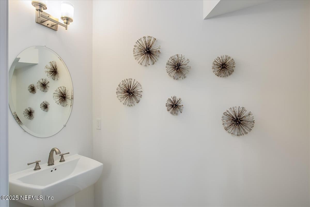 109 Rimini Court Jacksonville, FL 32225 - Photo 12 of 27 a bathroom with a sink and mirror