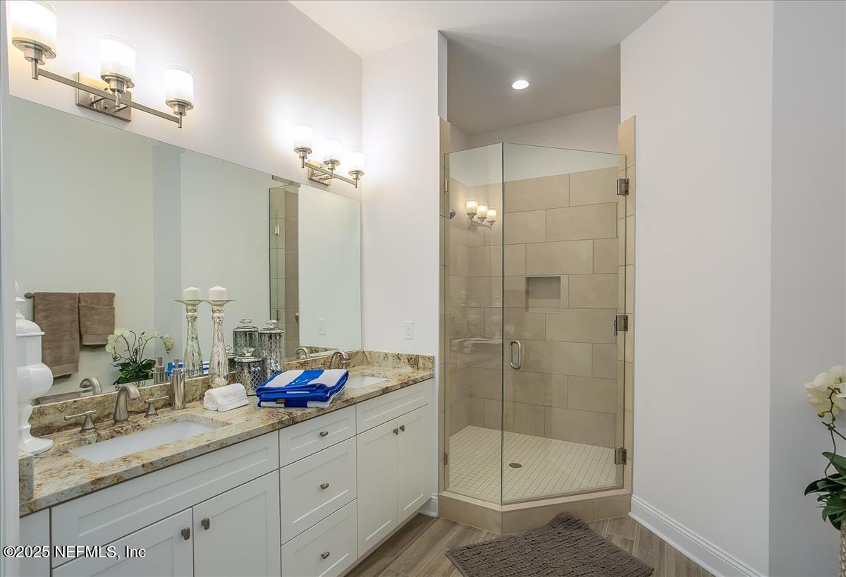 109 Rimini Court Jacksonville, FL 32225 - Photo 15 of 27 a bathroom with a shower sink and mirror
