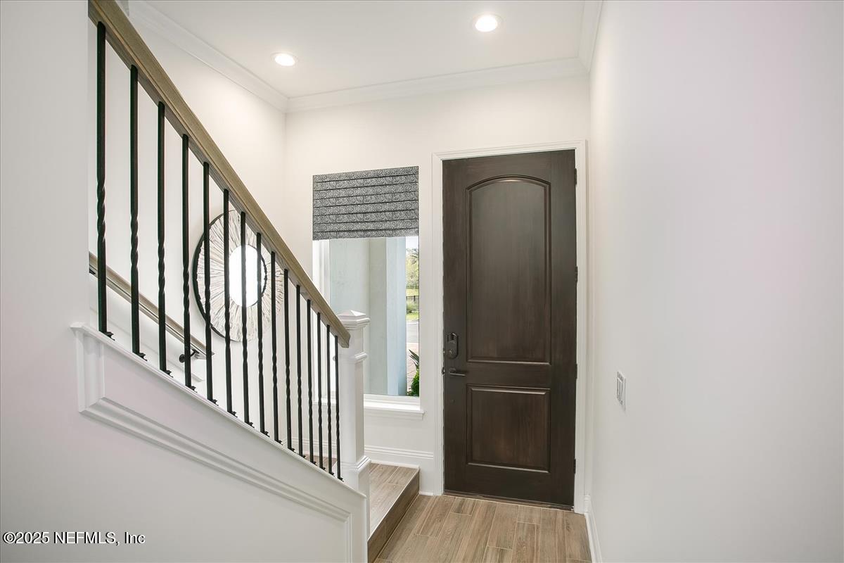109 Rimini Court Jacksonville, FL 32225 - Photo 3 of 27 a view of a hallway with wooden floor and staircase