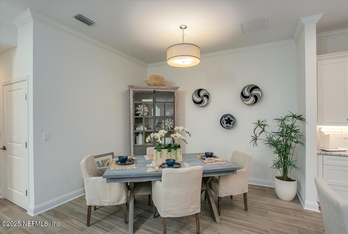 109 Rimini Court Jacksonville, FL 32225 - Photo 7 of 27 a view of a dining room with furniture and wooden floor