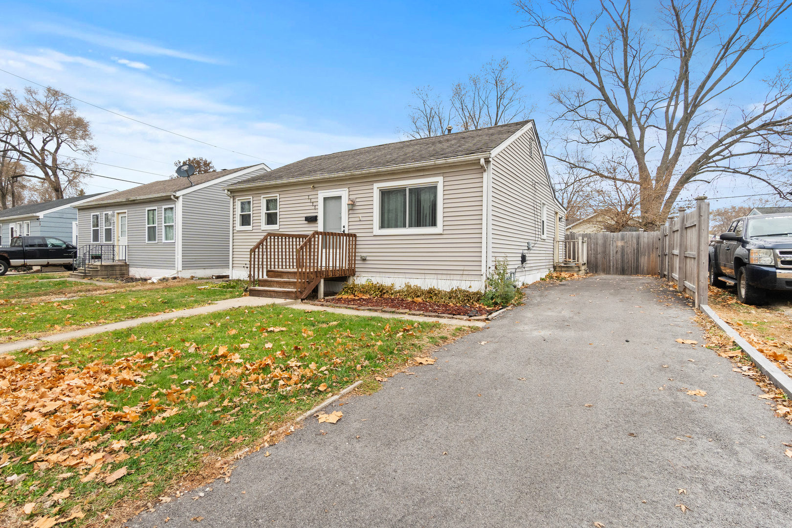 1111 North Kankakee Street Wilmington, IL 60481 - Photo 2 of 8 a front view of a house with a yard and trees