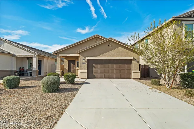 a front view of a house with seating space