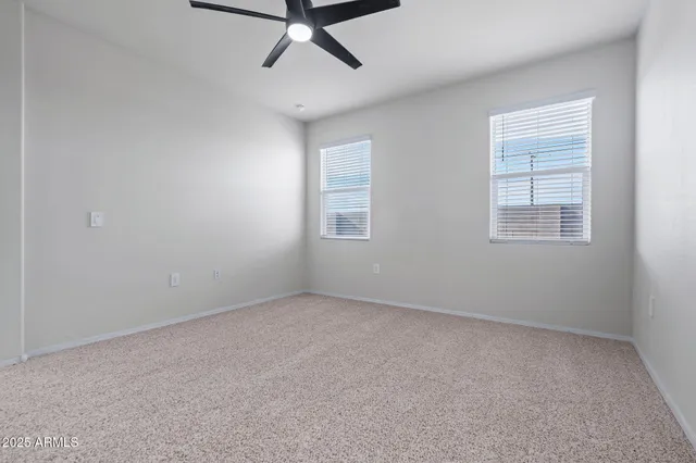 a bedroom with a bed and a potted plant