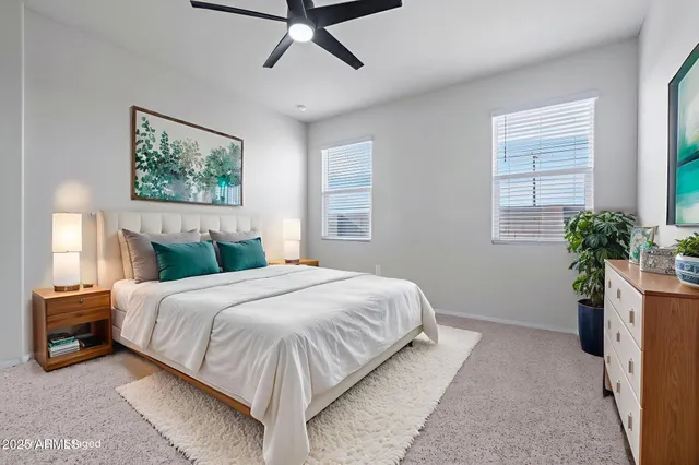 a view of an empty room with a ceiling fan