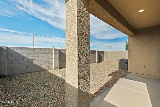 a view of a backyard of the house