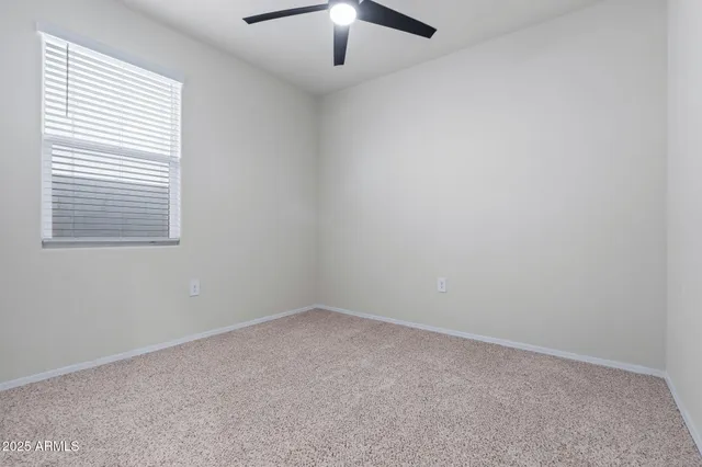 a view of a workspace with a bookshelf
