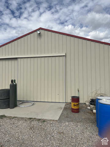 3839 Marshall Road Erda, UT 84029 - Photo 28 of 42 Metal-sided building with a red-trimmed gabled roof