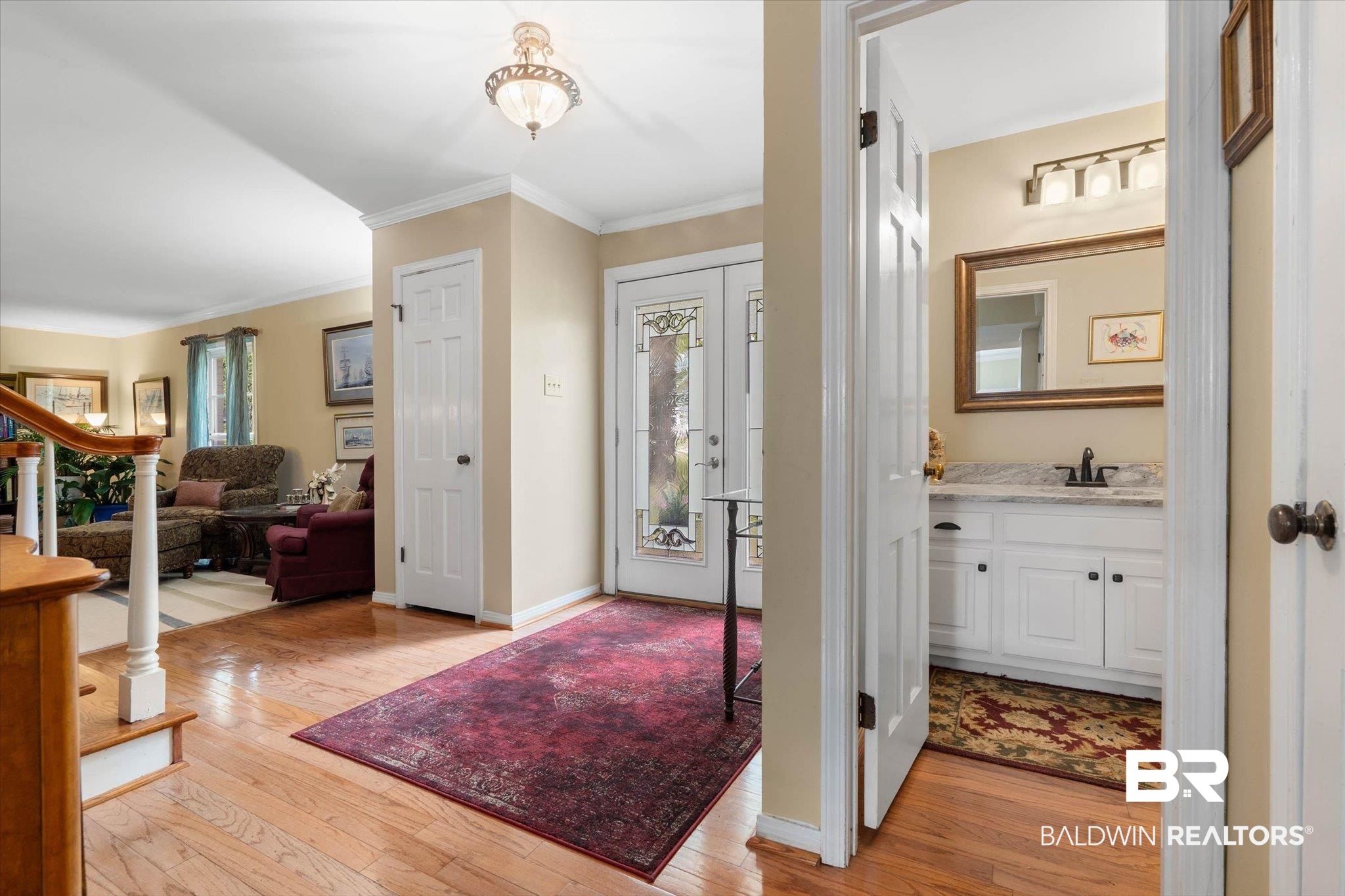 559 East Cumberland Road Mobile, AL 36608 - Photo 22 of 48 Entryway with light wood-type flooring and ornamental molding