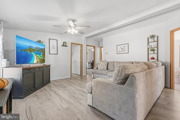 a bed room with a bed a couch and a window