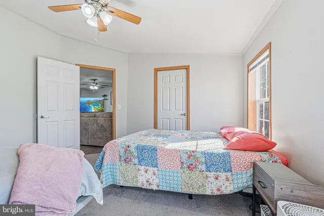 a bedroom with a bed and chandelier