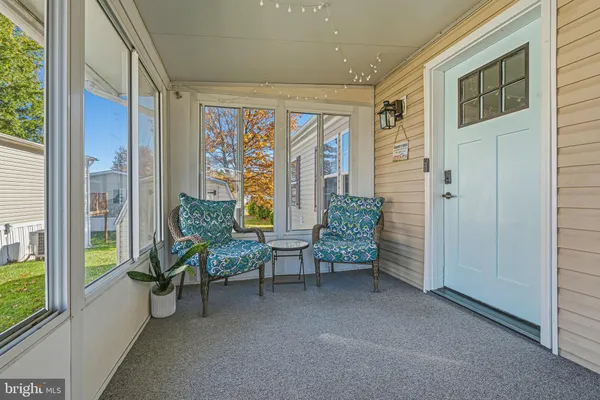 a view of a livingroom with furniture and windows