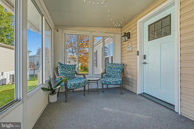 a view of a livingroom with furniture and windows
