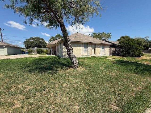 4805 Lavaca Drive, Unit 1 Corpus Christi, TX 78411 - Photo 2 of 7 a house that has a tree in front of it