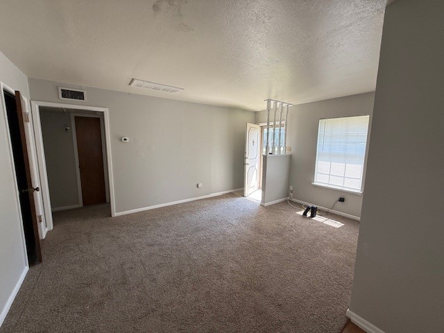 4805 Lavaca Drive, Unit 1 Corpus Christi, TX 78411 - Photo 3 of 7 an empty room with windows and closet
