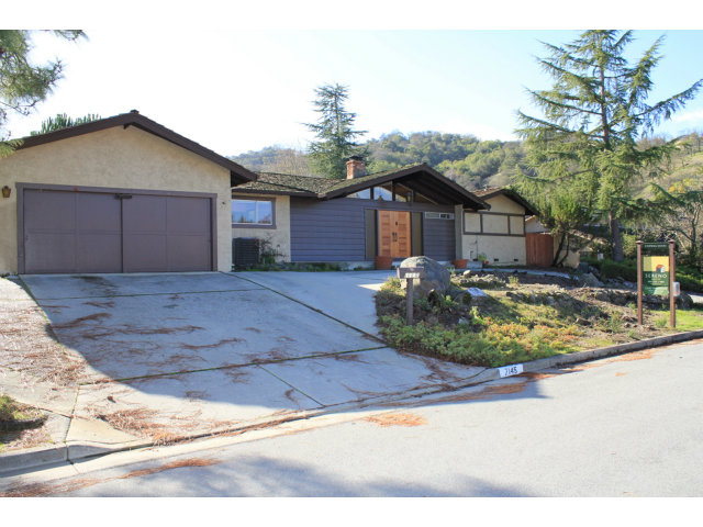 7145 Echo Loop San Jose, CA 95120 - Photo 1 of 8 a view of a house with a yard