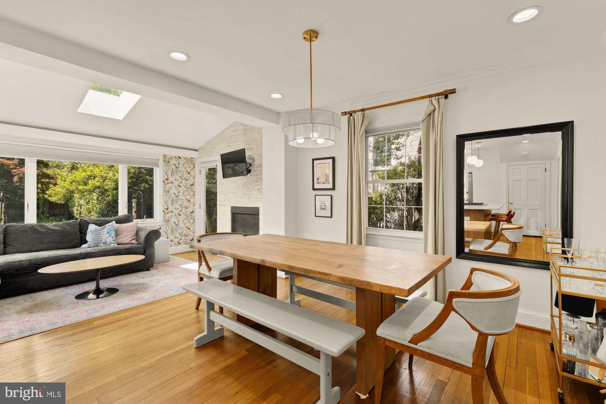 7208 Delfield Street Chevy Chase, MD 20815 - Photo 16 of 50 a living room with furniture a table and large windows