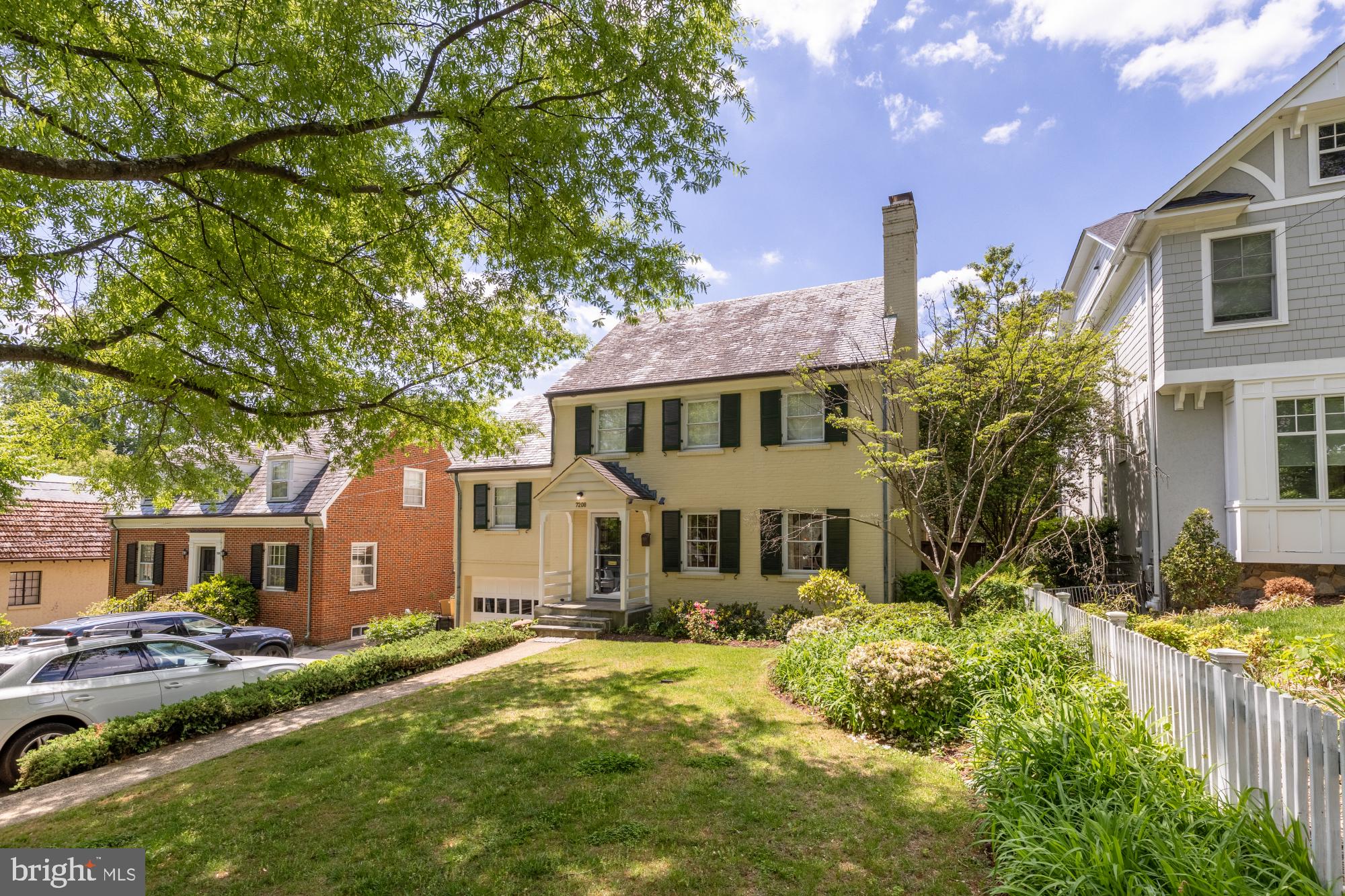 7208 Delfield Street Chevy Chase, MD 20815 - Photo 2 of 50 a front view of house with yard and trees around