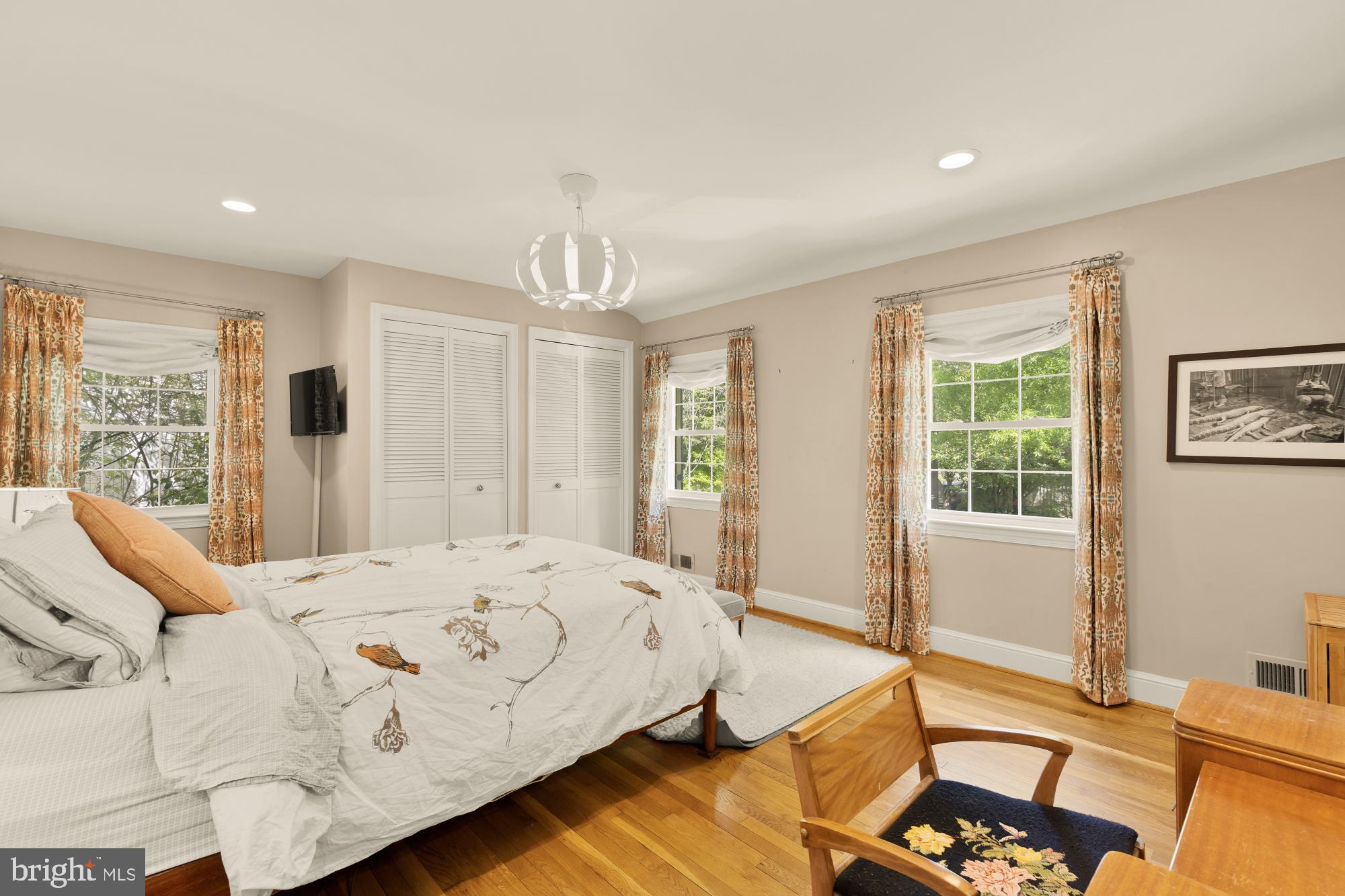 7208 Delfield Street Chevy Chase, MD 20815 - Photo 22 of 50 a bedroom with a bed and a table with chair